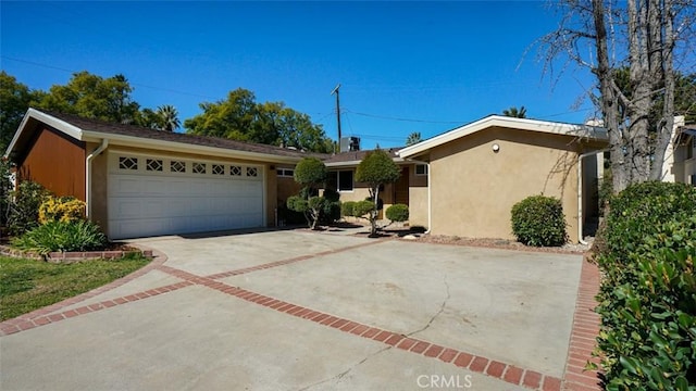 16347 Tupper St, North Hills, CA 91343 - ranch-style home with concrete driveway, a garage, and stucco siding