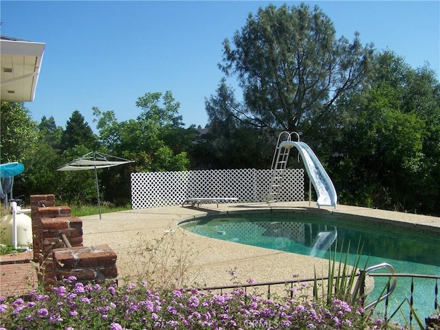 95 Riverview Dr, Oroville, CA 95966 - view of swimming pool with a water slide, a diving board, and a patio area