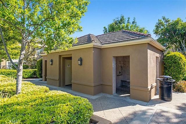 20 Fecamp, Newport Coast, CA 92657 - view of front of house featuring a tile roof and stucco siding