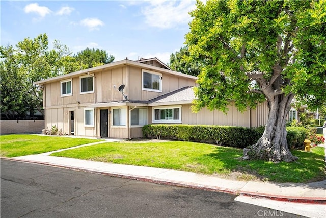 26406 Paseo Pamela, San Juan Capistrano, CA 92675 - traditional-style house with a front yard and board and batten siding