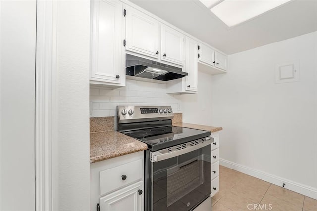26406 Paseo Pamela, San Juan Capistrano, CA 92675 - kitchen with stainless steel electric range, under cabinet range hood, baseboards, backsplash, and light countertops