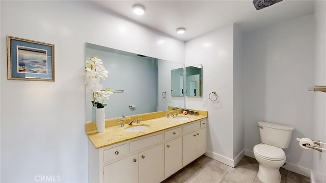649 Paseo De La Playa Unit 303, Redondo Beach, CA 90277 - full bathroom featuring double vanity, toilet, baseboards, and tile patterned flooring