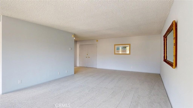 649 Paseo De La Playa Unit 303, Redondo Beach, CA 90277 - empty room featuring light colored carpet and a textured ceiling