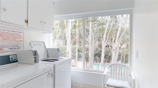 649 Paseo De La Playa Unit 303, Redondo Beach, CA 90277 - washroom with washer and clothes dryer, cabinet space, and plenty of natural light