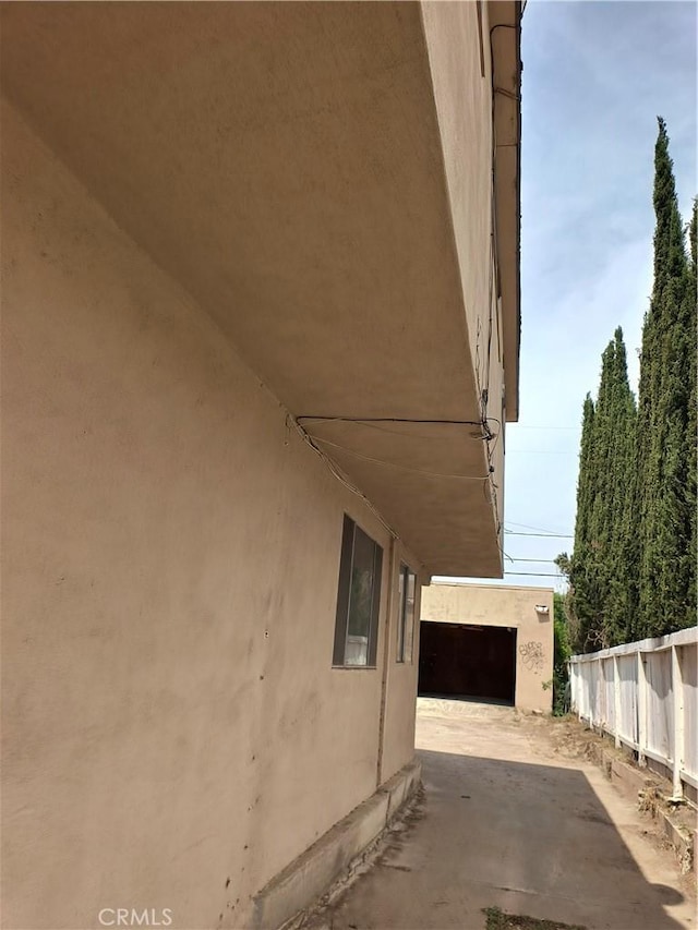 931 N Alamo St, Anaheim, CA 92801 - view of side of home featuring stucco siding and a patio