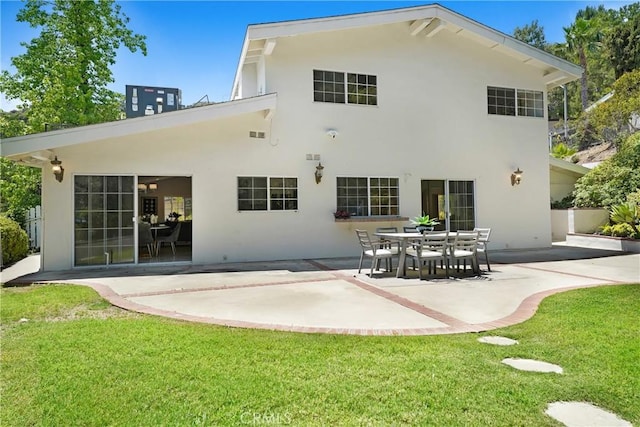 17043 Empanada Pl, Encino, CA 91436 - back of property featuring stucco siding, a patio, and a yard