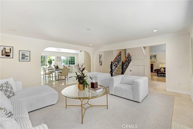 17043 Empanada Pl, Encino, CA 91436 - living room featuring arched walkways, ornamental molding, recessed lighting, stairway, and light tile patterned floors