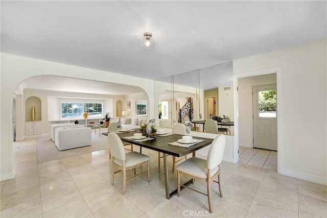 17043 Empanada Pl, Encino, CA 91436 - dining area with arched walkways and light tile patterned floors