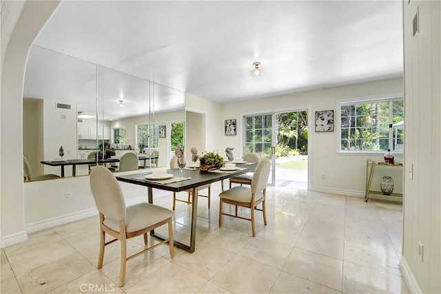 17043 Empanada Pl, Encino, CA 91436 - dining space with light tile patterned floors and arched walkways