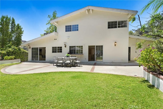 17043 Empanada Pl, Encino, CA 91436 - back of house featuring a patio, stucco siding, and a lawn