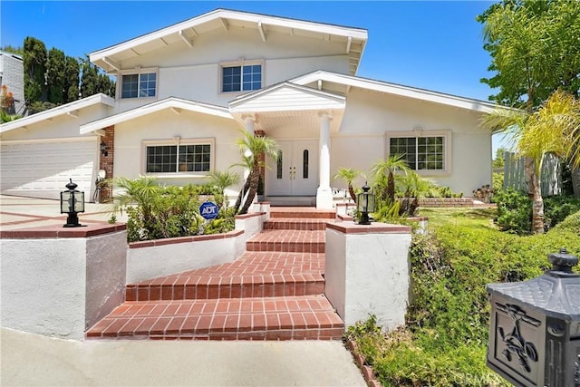 17043 Empanada Pl, Encino, CA 91436 - view of front of property with a garage, stucco siding, and french doors