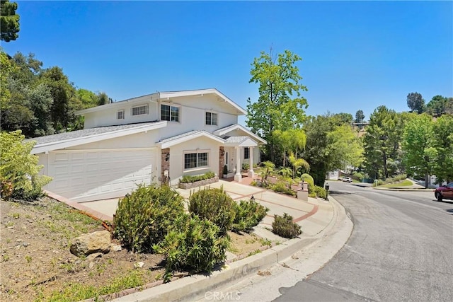 17043 Empanada Pl, Encino, CA 91436 - traditional-style house with stucco siding and an attached garage