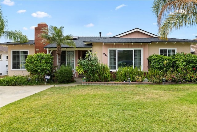 945 W Bonnie Brae Ct, Ontario, CA 91762 - ranch-style home featuring a front lawn, a chimney, and stucco siding