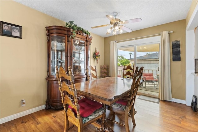 945 W Bonnie Brae Ct, Ontario, CA 91762 - dining room with light wood-style flooring, baseboards, a ceiling fan, and a textured ceiling