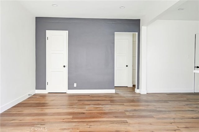 4427 Exposition Blvd, Los Angeles, CA 90016 - empty room with light wood finished floors, baseboards, and recessed lighting