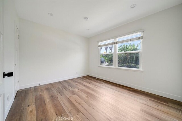 4427 Exposition Blvd, Los Angeles, CA 90016 - unfurnished room with wood finished floors and baseboards