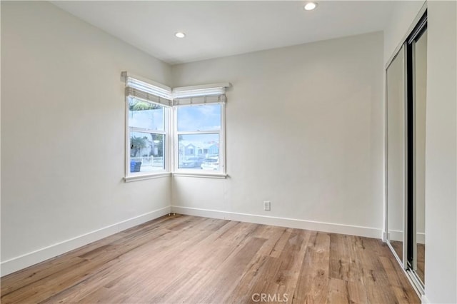 4427 Exposition Blvd, Los Angeles, CA 90016 - unfurnished bedroom with light wood-style floors, baseboards, a closet, and recessed lighting