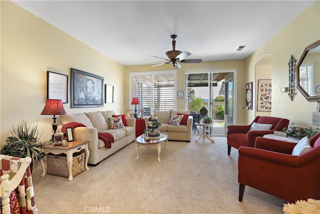 841 Bermuda Dr, Hemet, CA 92543 - living room featuring light carpet, a ceiling fan, and arched walkways