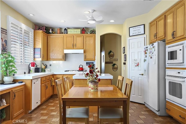 841 Bermuda Dr, Hemet, CA 92543 - kitchen featuring white appliances, under cabinet range hood, light countertops, a sink, and a ceiling fan