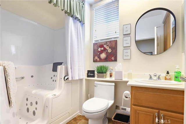 841 Bermuda Dr, Hemet, CA 92543 - bathroom featuring a jetted tub, vanity, and toilet