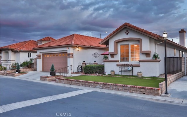 841 Bermuda Dr, Hemet, CA 92543 - mediterranean / spanish-style house featuring a garage, a front lawn, a tile roof, and driveway