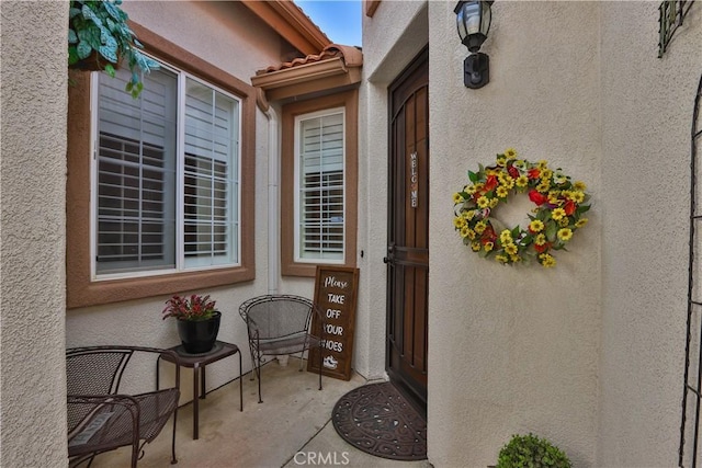 841 Bermuda Dr, Hemet, CA 92543 - property entrance with stucco siding and a tiled roof