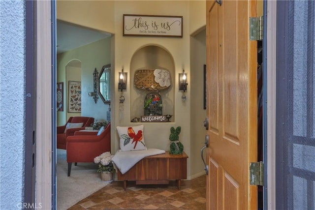 841 Bermuda Dr, Hemet, CA 92543 - foyer entrance featuring arched walkways, a heating unit, and stone finish floors