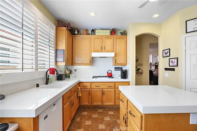 841 Bermuda Dr, Hemet, CA 92543 - kitchen featuring a sink, white appliances, stone finish floors, under cabinet range hood, and arched walkways