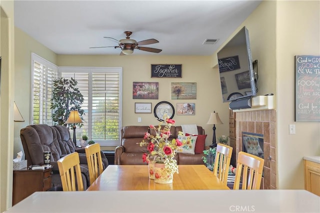 841 Bermuda Dr, Hemet, CA 92543 - dining area featuring ceiling fan and a fireplace
