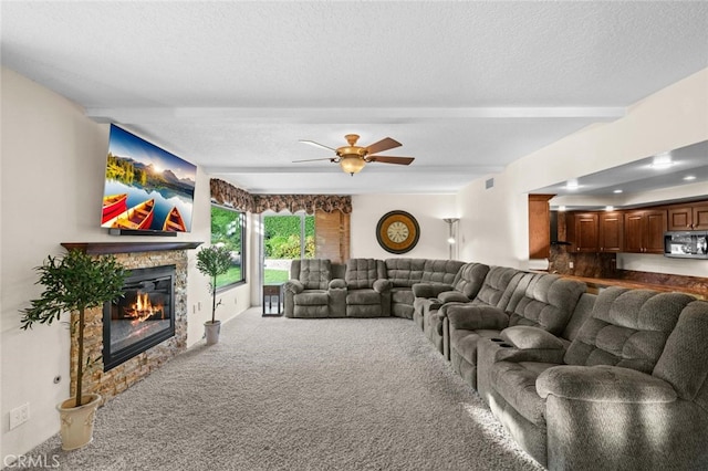 4187 Pepper Ave, Yorba Linda, CA 92886 - carpeted living area featuring a fireplace, beamed ceiling, a ceiling fan, and a textured ceiling