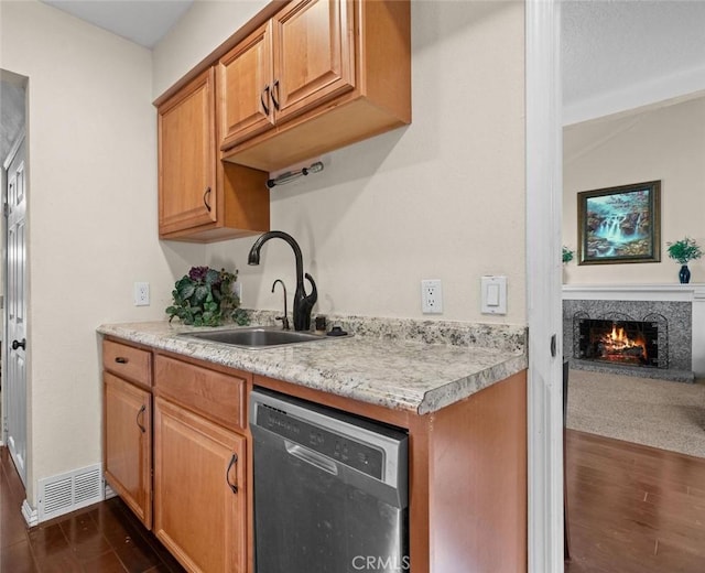 4187 Pepper Ave, Yorba Linda, CA 92886 - kitchen with dishwasher, dark wood-style flooring, light countertops, and a premium fireplace