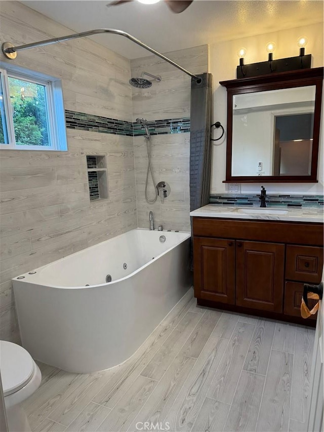 4187 Pepper Ave, Yorba Linda, CA 92886 - bathroom featuring wood finished floors, a combined bath / shower with jetted tub, and vanity