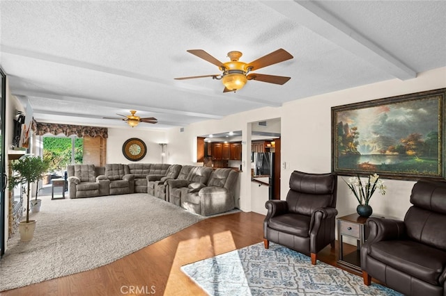 4187 Pepper Ave, Yorba Linda, CA 92886 - living area featuring a ceiling fan, beamed ceiling, wood finished floors, and a textured ceiling