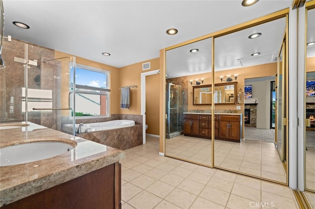 4187 Pepper Ave, Yorba Linda, CA 92886 - full bathroom featuring double vanity, a stall shower, a garden tub, tile patterned flooring, and recessed lighting