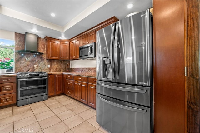 4187 Pepper Ave, Yorba Linda, CA 92886 - kitchen with stainless steel appliances, wall chimney range hood, tasteful backsplash, light tile patterned flooring, and brown cabinetry