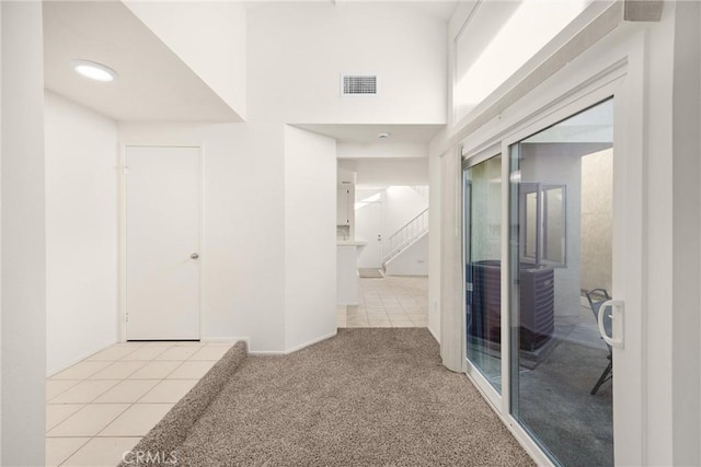 625 E Merion St, Ontario, CA 91761 - hall with light colored carpet and light tile patterned floors