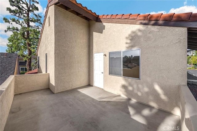 625 E Merion St, Ontario, CA 91761 - entrance to property with stucco siding and a balcony