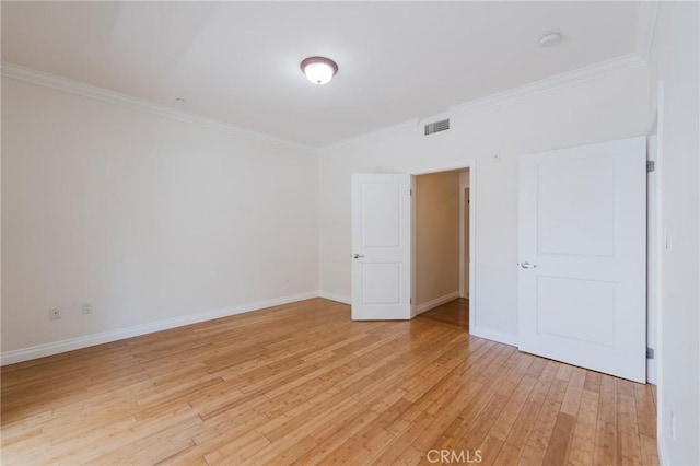 3061 W 12th Pl Unit 101, Los Angeles, CA 90006 - unfurnished bedroom featuring crown molding, light wood-style flooring, and baseboards