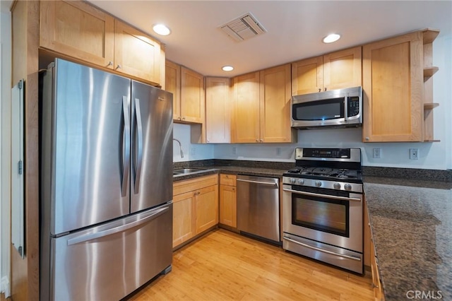 3061 W 12th Pl Unit 101, Los Angeles, CA 90006 - kitchen with appliances with stainless steel finishes, open shelves, light wood-style floors, recessed lighting, and light brown cabinetry