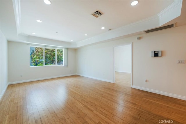 3061 W 12th Pl Unit 101, Los Angeles, CA 90006 - spare room featuring a raised ceiling, ornamental molding, baseboards, recessed lighting, and light wood finished floors