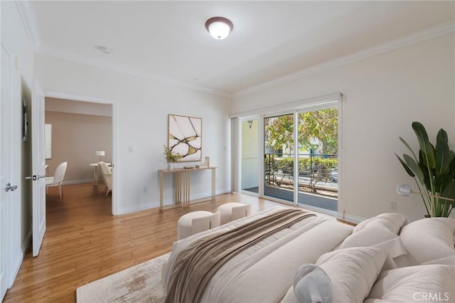 3061 W 12th Pl Unit 101, Los Angeles, CA 90006 - bedroom with access to exterior, ornamental molding, light wood-style flooring, and baseboards