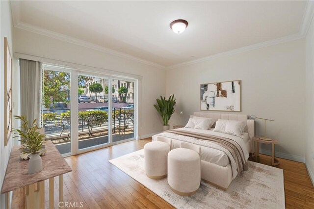3061 W 12th Pl Unit 101, Los Angeles, CA 90006 - bedroom with access to exterior, ornamental molding, light wood-style floors, and baseboards
