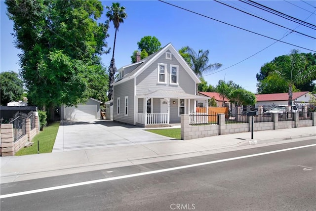 1835 Martin Luther King Blvd, Riverside, CA 92507 - view of front of home with covered porch, an outdoor structure, a garage, and a chimney