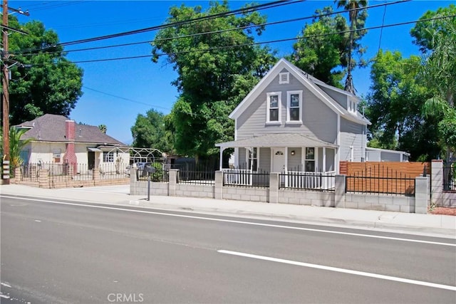 1835 Martin Luther King Blvd, Riverside, CA 92507 - view of front of home with a fenced front yard, a porch, and a gate