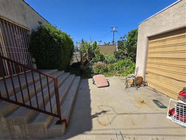 5738 S Mullen Ave, Los Angeles, CA 90043 - view of patio featuring a garage