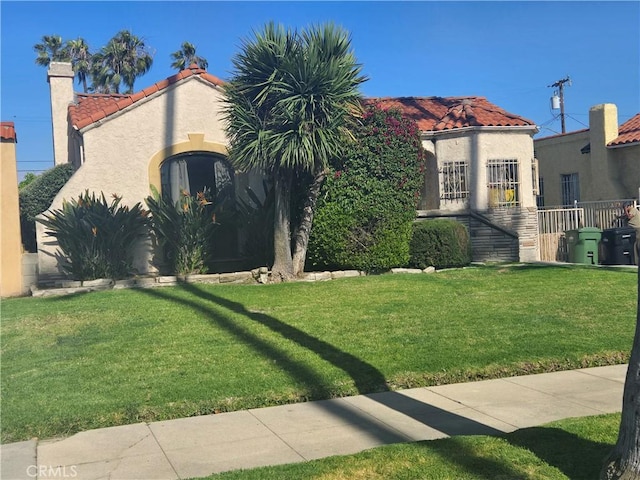 5738 S Mullen Ave, Los Angeles, CA 90043 - mediterranean / spanish-style house featuring a tile roof and stucco siding