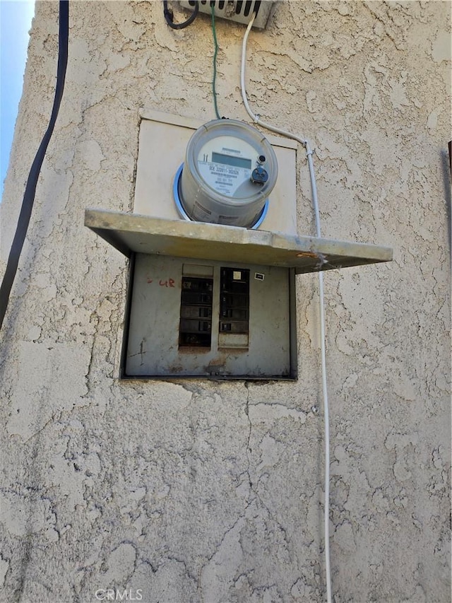 5738 S Mullen Ave, Los Angeles, CA 90043 - exterior view of stucco siding and electric meter