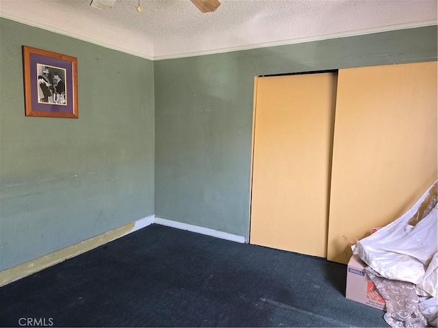 5738 S Mullen Ave, Los Angeles, CA 90043 - bedroom with a textured ceiling, crown molding, and dark colored carpet
