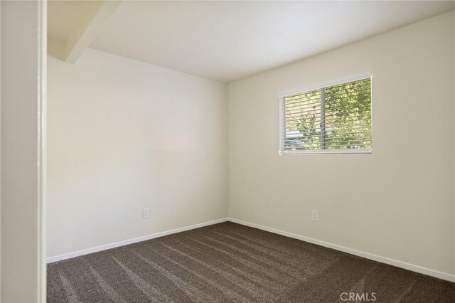32296 Fern Dr, Running Springs, CA 92382 - unfurnished room featuring dark carpet and baseboards