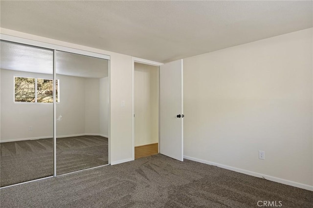 32296 Fern Dr, Running Springs, CA 92382 - unfurnished bedroom with carpet floors, a closet, and baseboards